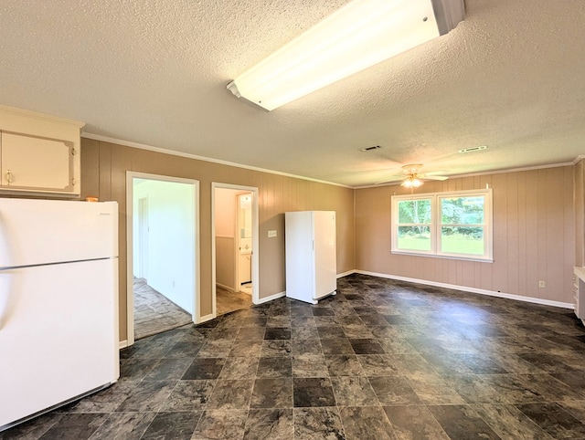 602 Cobb Rd, Dothan, AL 36301 - spare room with a textured ceiling, crown molding, ceiling fan, and wooden walls