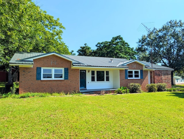 602 Cobb Rd, Dothan, AL 36301 - ranch-style house featuring a front lawn, a metal roof, and brick siding