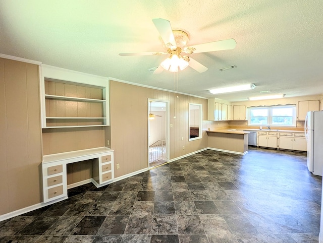 602 Cobb Rd, Dothan, AL 36301 - unfurnished living room featuring a textured ceiling, a ceiling fan, crown molding, and built in study area