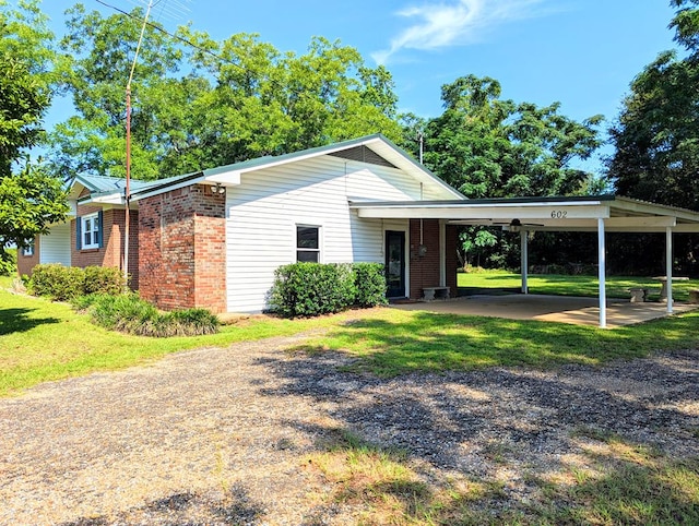 602 Cobb Rd, Dothan, AL 36301 - single story home with brick siding, a front yard, and an attached carport