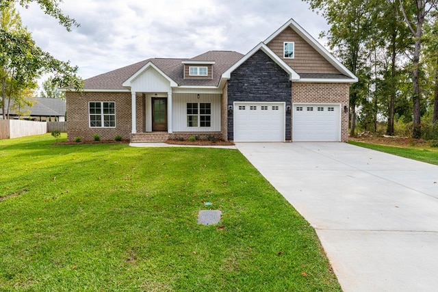 craftsman-style home with covered porch, a garage, and a front yard