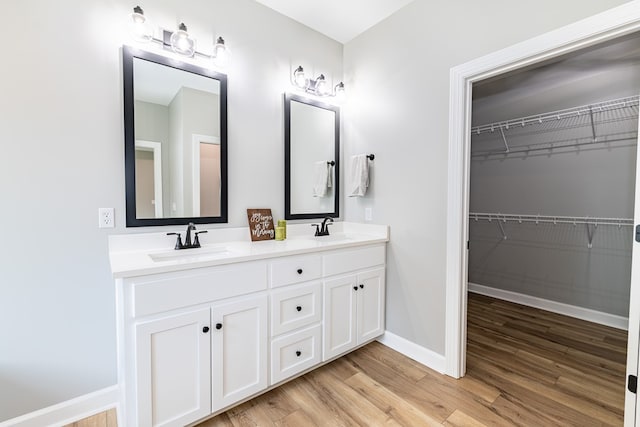 bathroom with vanity and hardwood / wood-style flooring