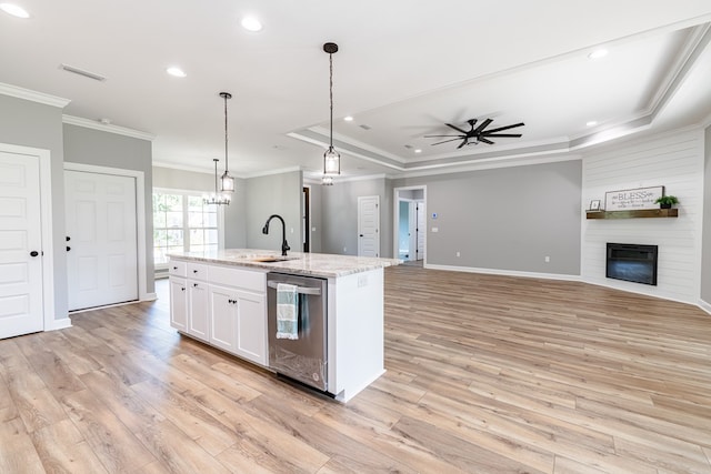 kitchen with stainless steel dishwasher, white cabinets, a kitchen island with sink, and light hardwood / wood-style flooring