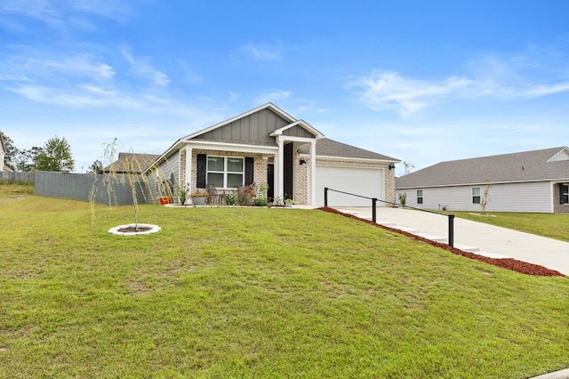 view of front of property featuring a front yard and a garage