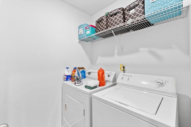 clothes washing area with independent washer and dryer