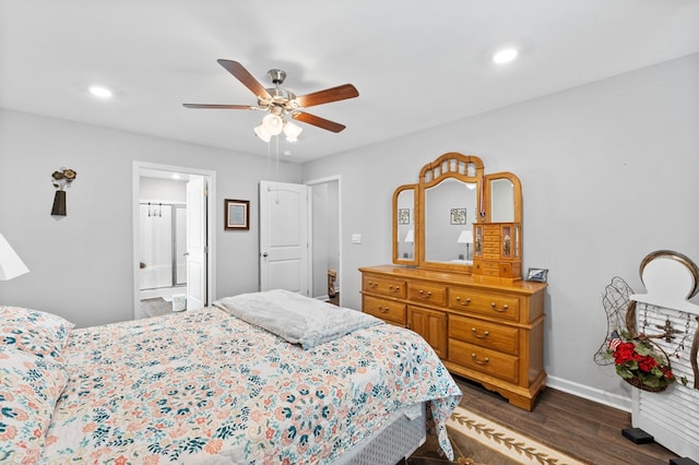 bedroom featuring dark hardwood / wood-style floors, ceiling fan, and ensuite bathroom