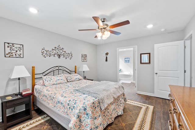 bedroom featuring dark hardwood / wood-style flooring, ensuite bathroom, and ceiling fan