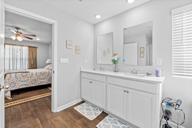 bathroom featuring vanity, hardwood / wood-style flooring, and ceiling fan