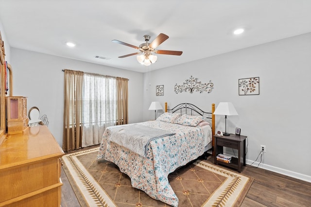 bedroom featuring dark hardwood / wood-style flooring and ceiling fan