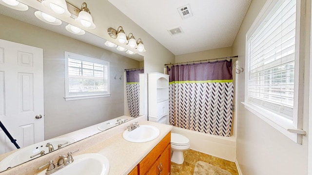 284 Alec Cir, Ozark, AL 36360 - bathroom featuring toilet, double vanity, and shower / tub combo