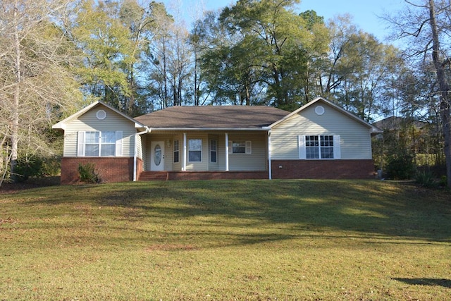 ranch-style home featuring brick siding, a porch, and a front yard