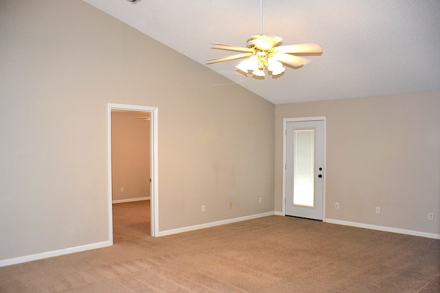 empty room featuring light carpet, ceiling fan, high vaulted ceiling, and baseboards