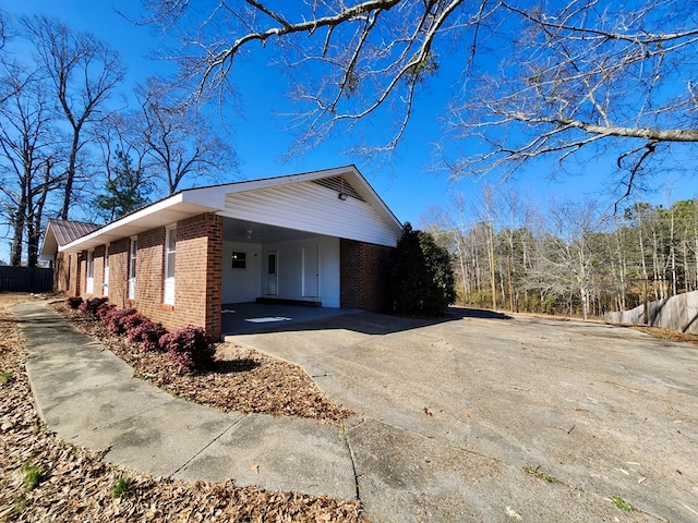 view of property exterior with a carport