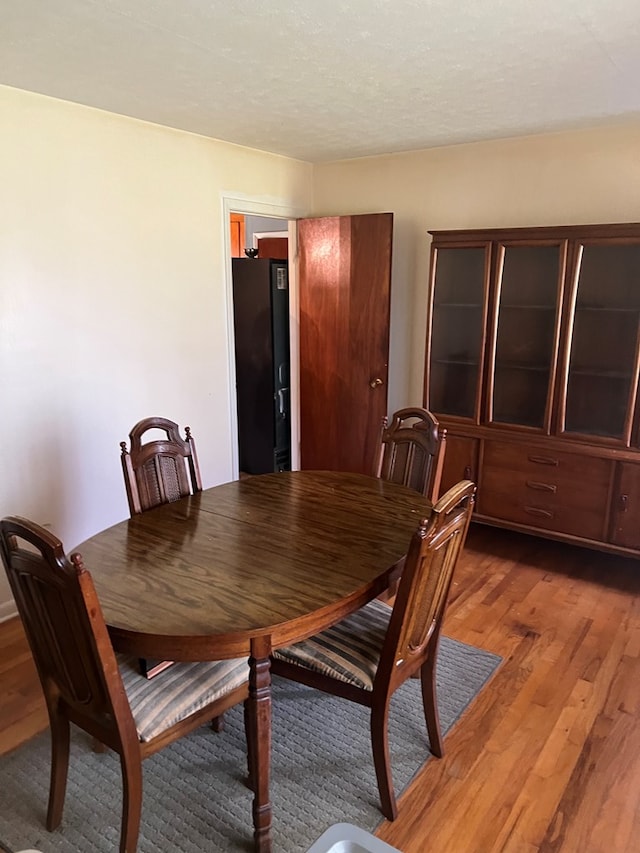 dining space featuring hardwood / wood-style floors