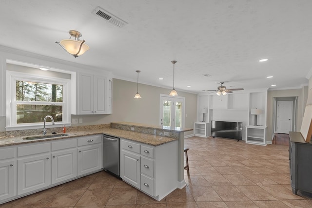 kitchen featuring sink, white cabinetry, light stone counters, kitchen peninsula, and dishwasher