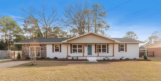 ranch-style house featuring a porch and a front yard