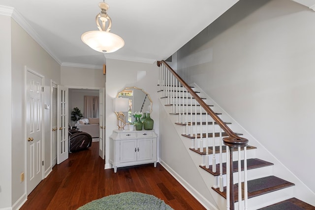 stairway featuring crown molding and hardwood / wood-style floors