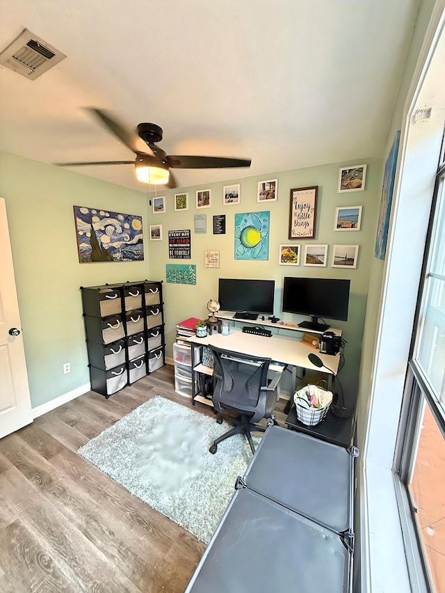 office area with ceiling fan and hardwood / wood-style floors