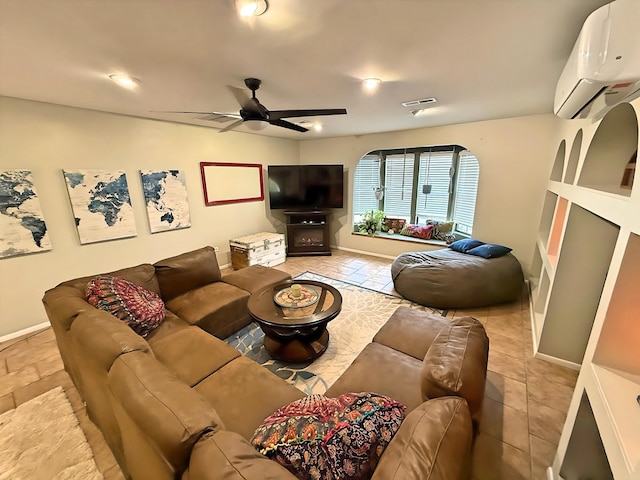 living room featuring ceiling fan and a wall mounted AC