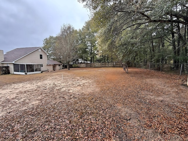 view of yard featuring a sunroom