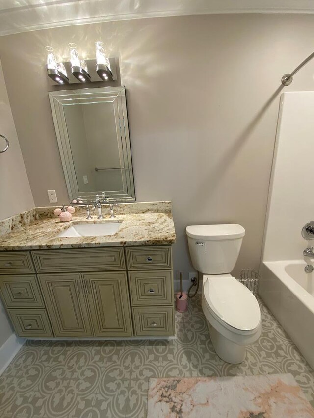 full bathroom featuring tile patterned flooring, toilet, vanity, and washtub / shower combination