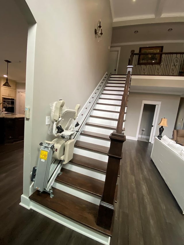 stairway with hardwood / wood-style flooring