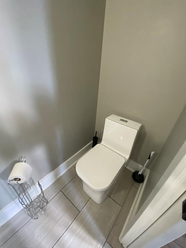 bathroom with tile patterned floors and toilet