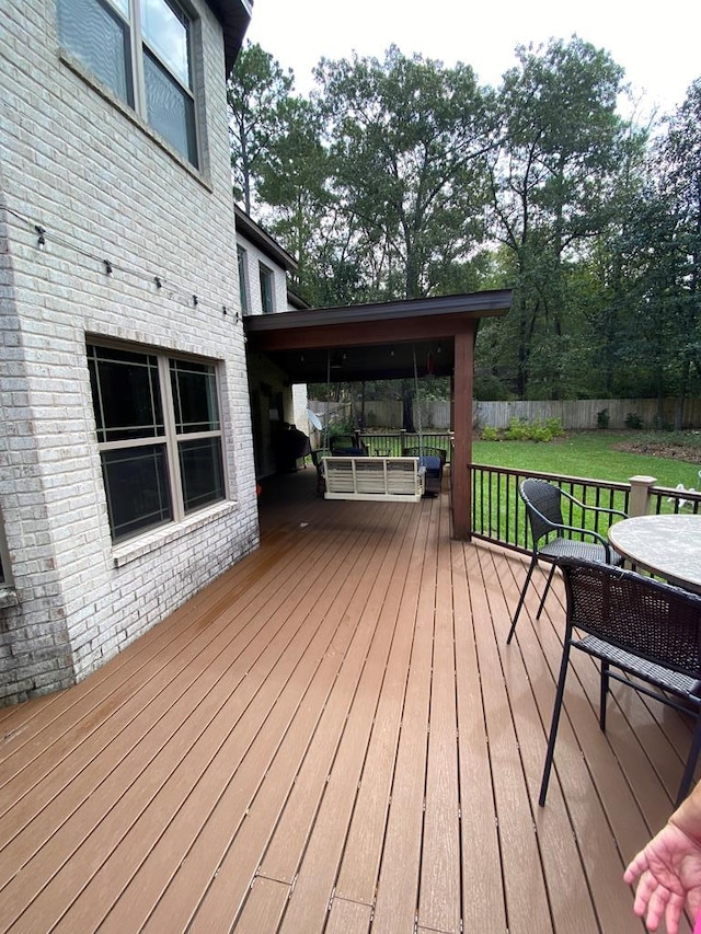 deck featuring a lawn