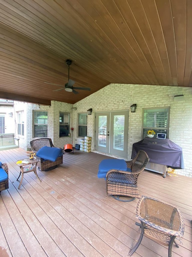 wooden deck with area for grilling, ceiling fan, and french doors