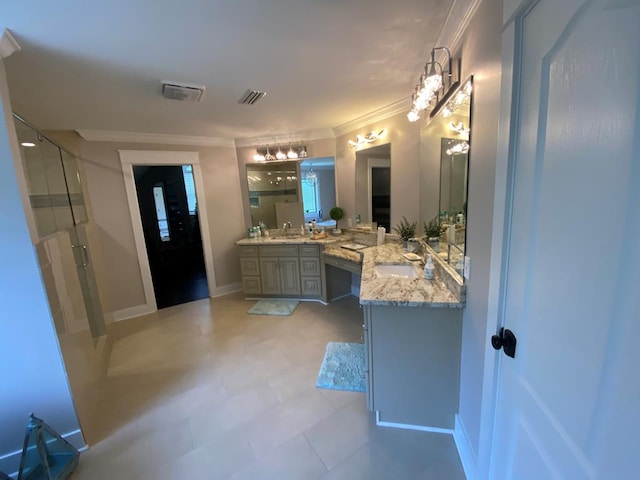 bathroom with vanity, an enclosed shower, and crown molding