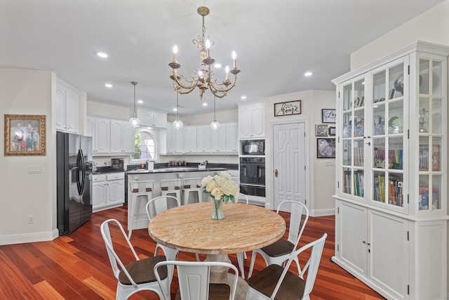 dining area featuring baseboards, a chandelier, dark wood-type flooring, and recessed lighting