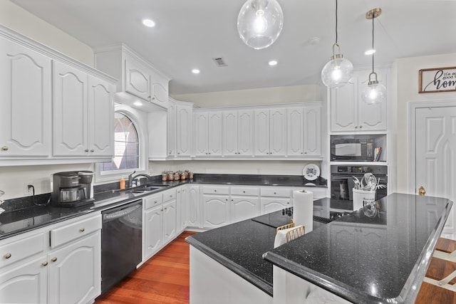 kitchen featuring a center island, black appliances, white cabinets, hanging light fixtures, and hardwood / wood-style flooring