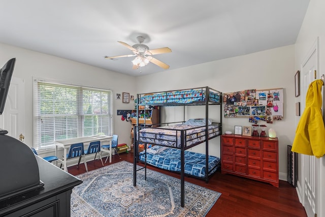 bedroom with ceiling fan and dark hardwood / wood-style floors