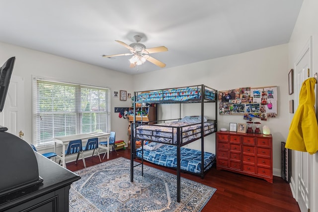 bedroom with ceiling fan and wood finished floors