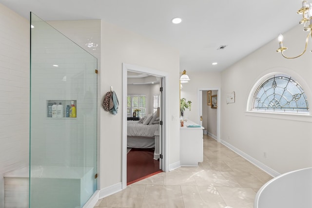 interior space with connected bathroom, recessed lighting, a notable chandelier, and a stall shower
