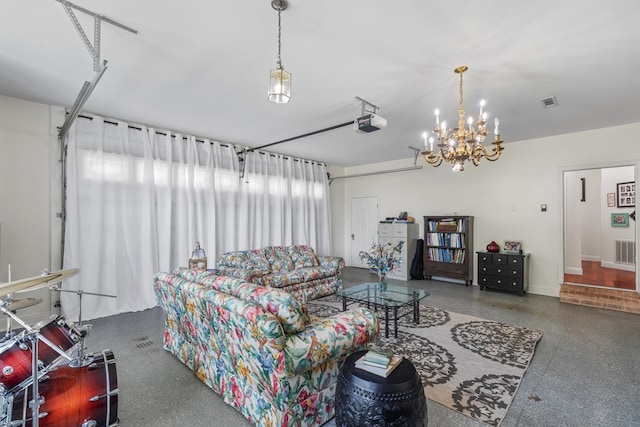 living room featuring speckled floor, visible vents, baseboards, and an inviting chandelier