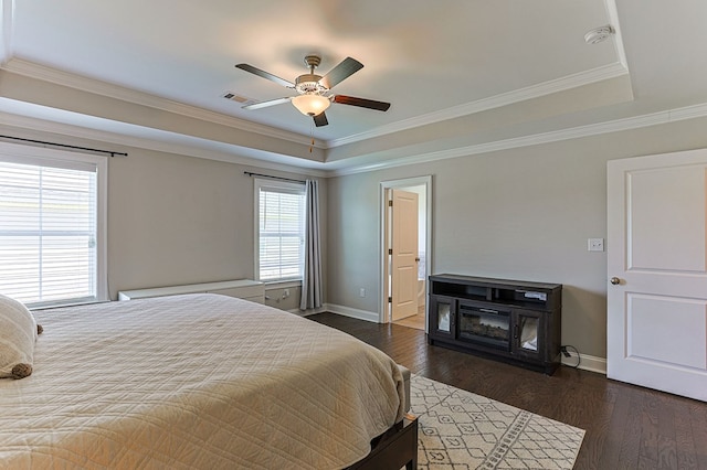 120 Puent Dr, Dothan, AL 36301 - bedroom with a tray ceiling, baseboards, dark wood finished floors, ornamental molding, and ceiling fan