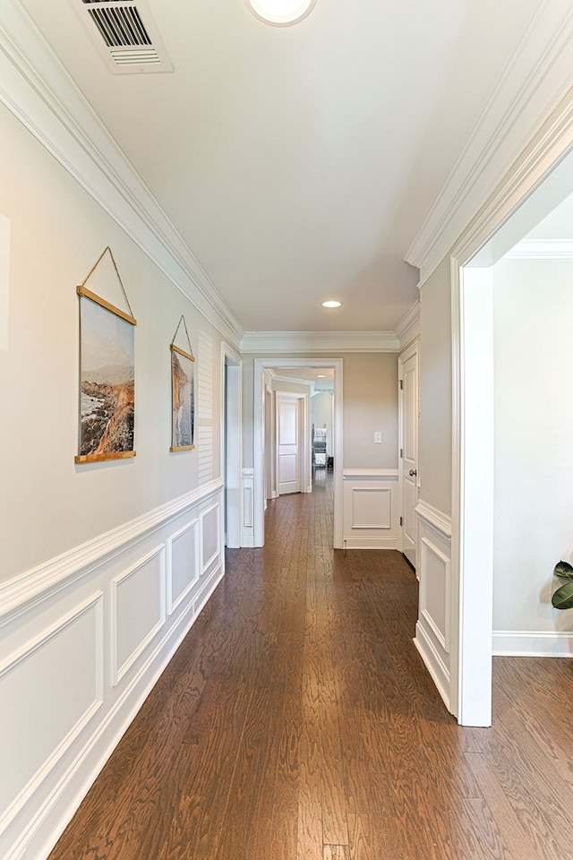 120 Puent Dr, Dothan, AL 36301 - hallway featuring a decorative wall, crown molding, dark wood-style floors, wainscoting, and recessed lighting