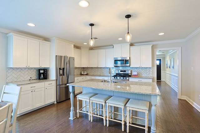 120 Puent Dr, Dothan, AL 36301 - kitchen with appliances with stainless steel finishes, a sink, white cabinets, dark wood finished floors, and tasteful backsplash