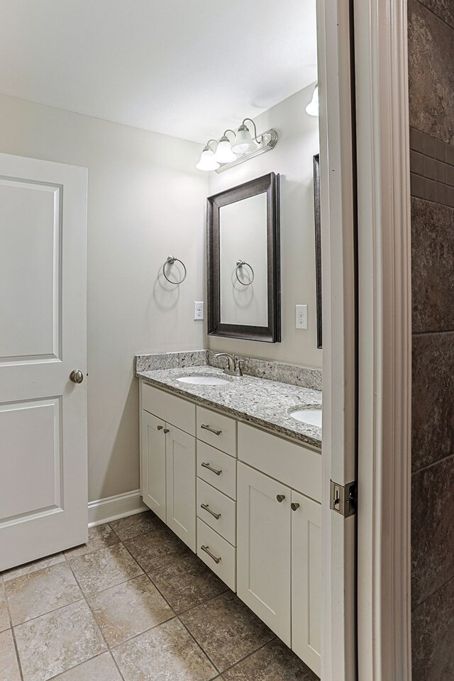 120 Puent Dr, Dothan, AL 36301 - bathroom with double vanity and baseboards