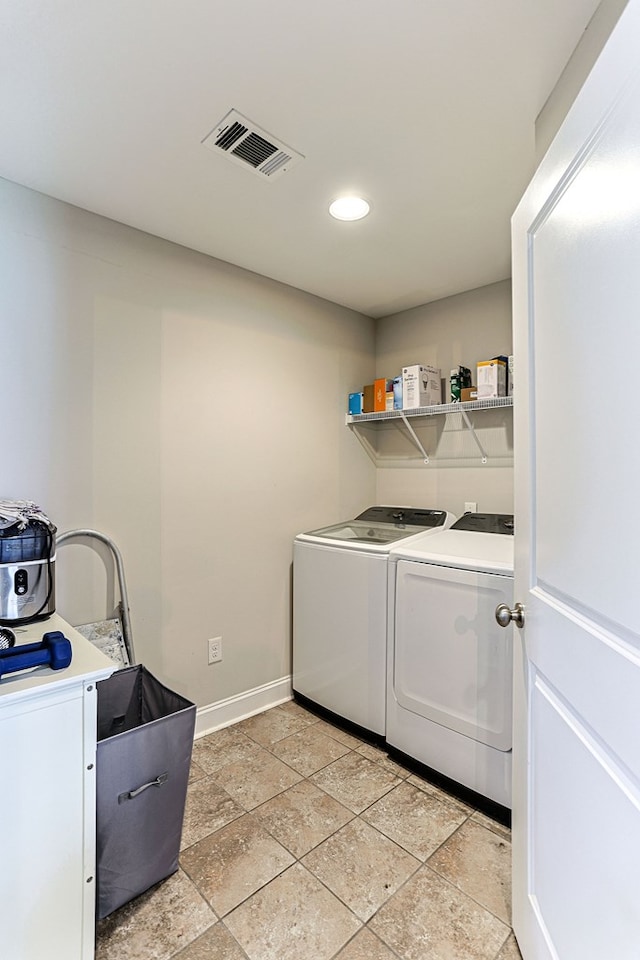 120 Puent Dr, Dothan, AL 36301 - laundry area with washing machine and clothes dryer, baseboards, recessed lighting, and stone tile flooring