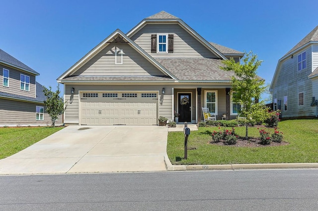 120 Puent Dr, Dothan, AL 36301 - view of front of house featuring a front yard, a garage, driveway, and roof with shingles
