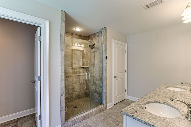 120 Puent Dr, Dothan, AL 36301 - bathroom with baseboards, a shower stall, and double vanity