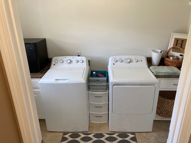 laundry area with separate washer and dryer