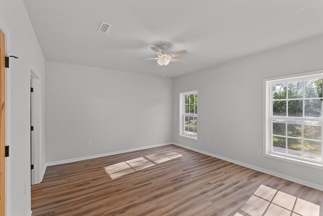 spare room featuring light wood-type flooring and ceiling fan