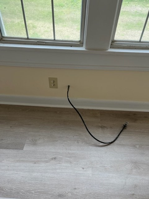 details with wood finished floors and baseboards