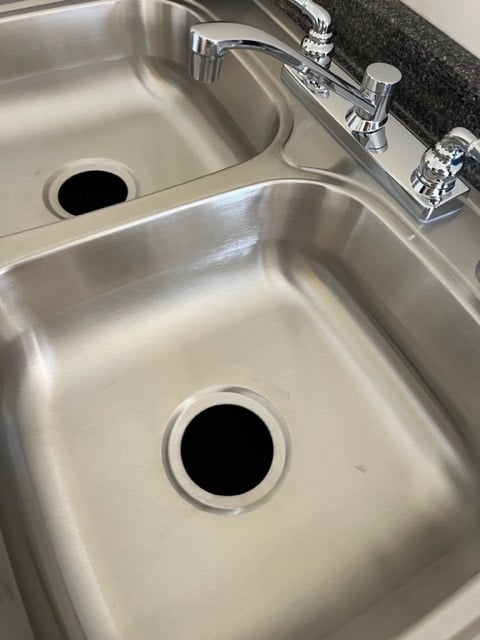 interior details featuring a sink