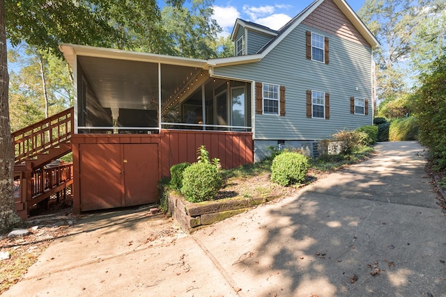 view of front of house featuring a sunroom