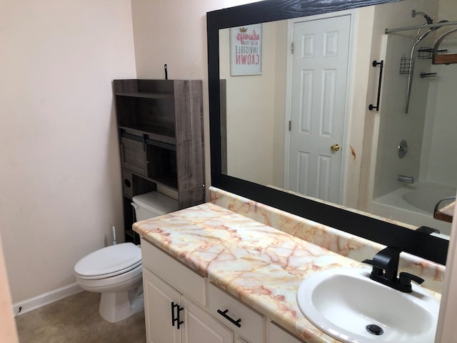 bathroom with toilet, bathing tub / shower combination, vanity, and baseboards