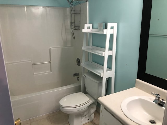 full bath with shower / tub combination, vanity, toilet, and tile patterned floors